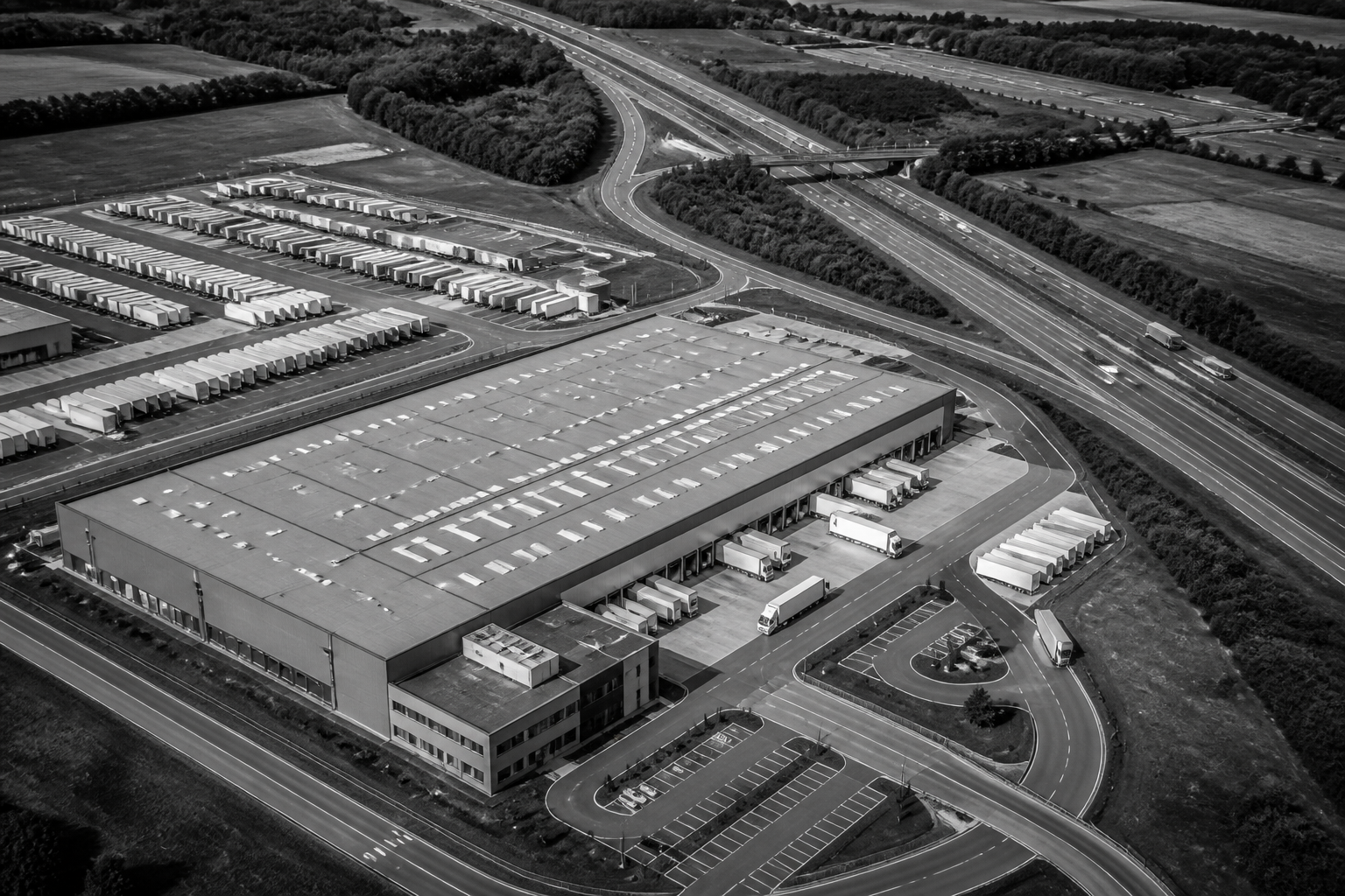 Aerial view of a European logistics building and motorway